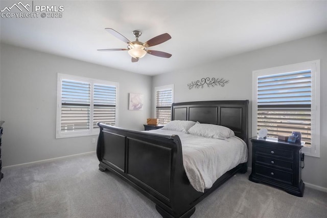 bedroom with carpet, baseboards, and a ceiling fan