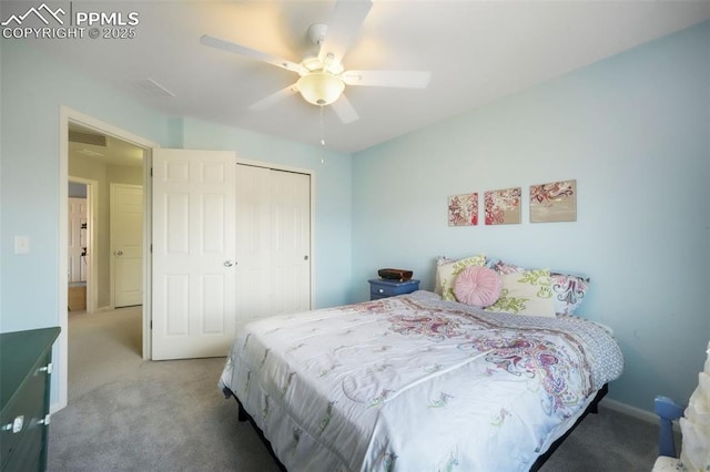 carpeted bedroom featuring a closet, a ceiling fan, and baseboards