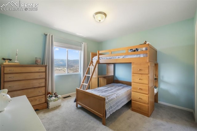 carpeted bedroom with baseboards