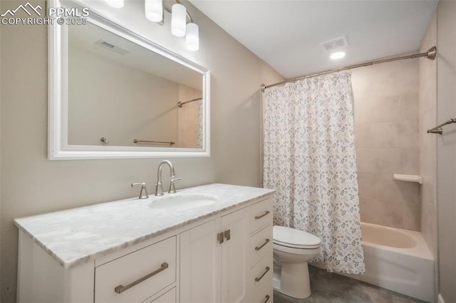 bathroom featuring toilet, shower / bath combo with shower curtain, and vanity