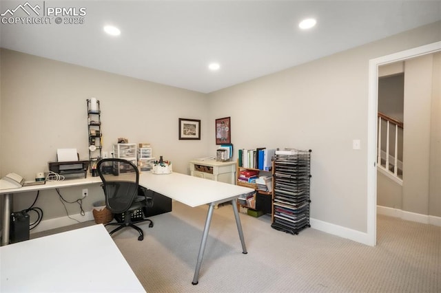 office space featuring light colored carpet, baseboards, and recessed lighting