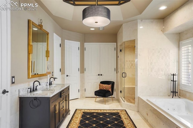 3285 El Pomar Rd, Colorado Springs, CO 80906 - bathroom with a stall shower, a tub with jets, double vanity, and tile patterned flooring