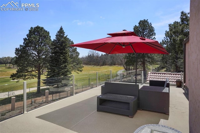 3285 El Pomar Rd, Colorado Springs, CO 80906 - view of patio / terrace with an outdoor hangout area and fence