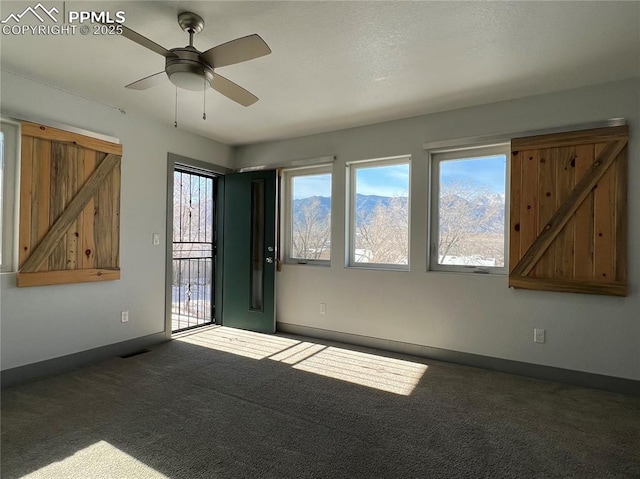 1407 Manitou Blvd, Colorado Springs, CO 80904 - carpeted empty room with a ceiling fan and baseboards
