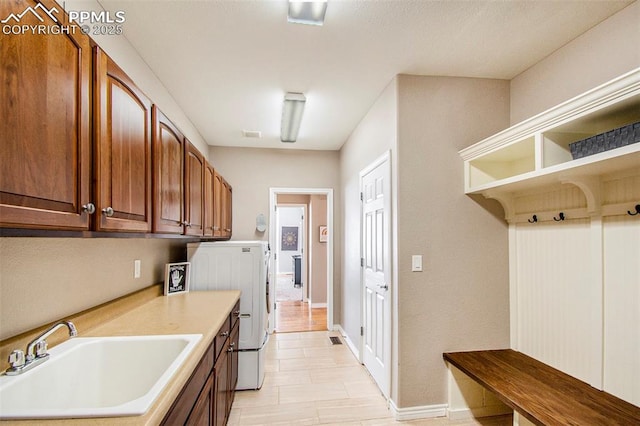 1828 Aquamarine Ct, Castle Rock, CO 80108 - laundry room with cabinet space, separate washer and dryer, and baseboards