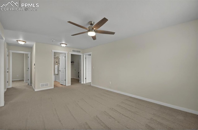 unfurnished bedroom with baseboards, carpet, ensuite bath, and ceiling fan