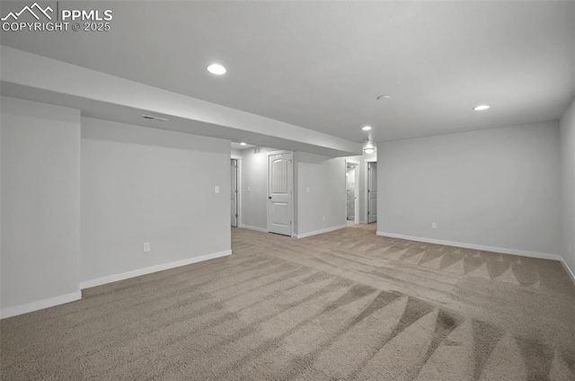 finished below grade area featuring recessed lighting, carpet floors, and baseboards