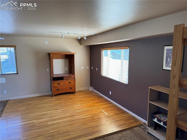 110 Yucca Ave, Florence, CO 81226 - unfurnished living room with light wood-style flooring and baseboards