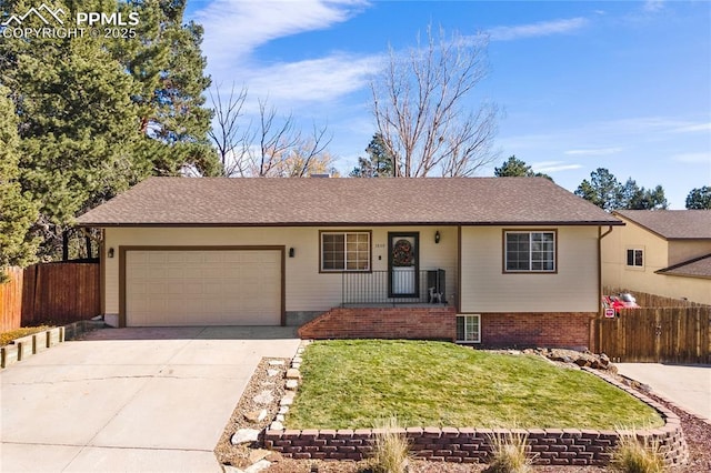 3809 N Hancock Ave, Colorado Springs, CO 80907 - ranch-style house featuring an attached garage, concrete driveway, and covered porch