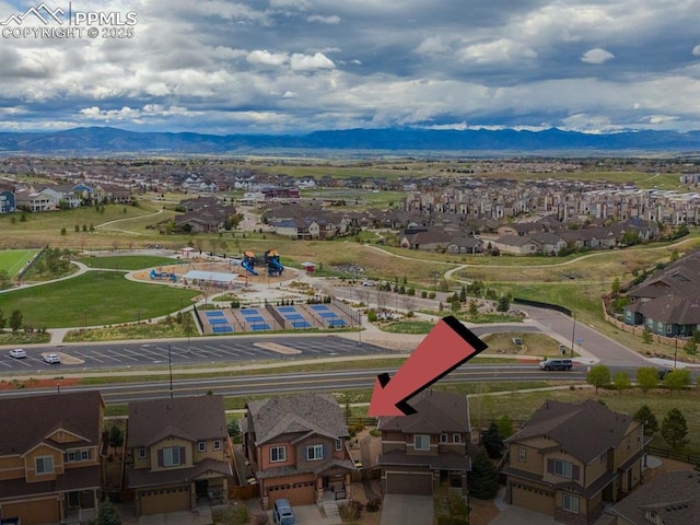 aerial view of residential area with mountains