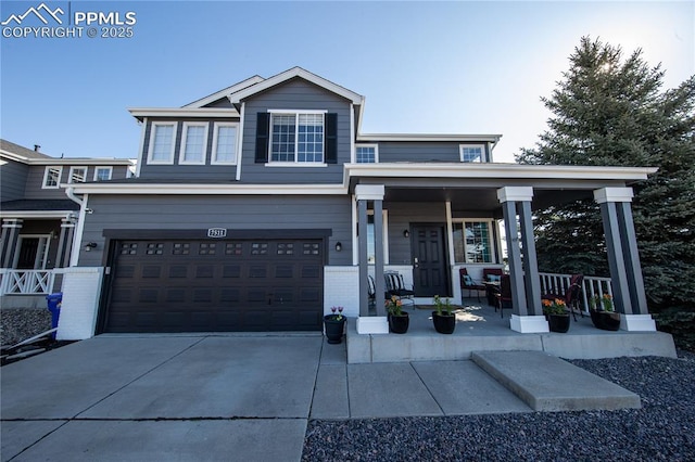 7511 Coffee Rd, Peyton, CO 80831 - view of front of house with a porch, a garage, brick siding, and driveway