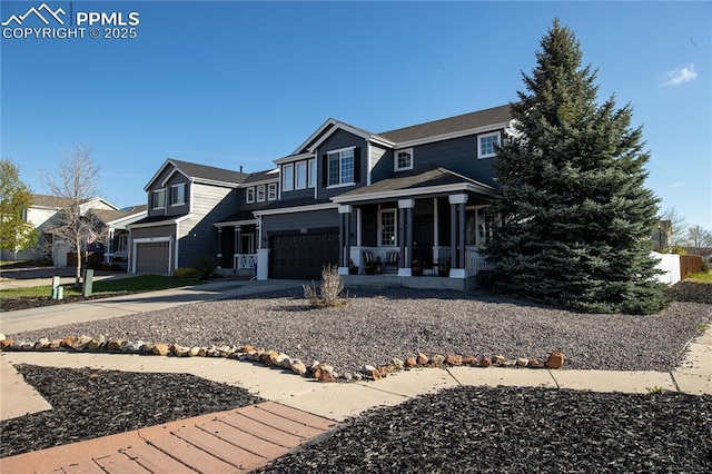 7511 Coffee Rd, Peyton, CO 80831 - view of front of property with an attached garage, a porch, and driveway