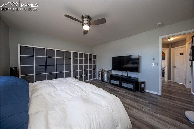 7511 Coffee Rd, Peyton, CO 80831 - bedroom featuring dark wood finished floors, baseboards, and ceiling fan