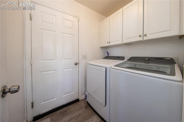 7511 Coffee Rd, Peyton, CO 80831 - laundry room with cabinet space, washer and dryer, and wood finished floors