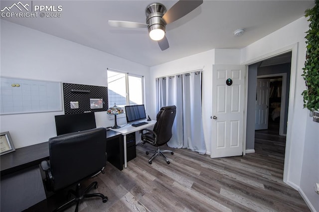 7511 Coffee Rd, Peyton, CO 80831 - office space featuring a ceiling fan, wood finished floors, and baseboards