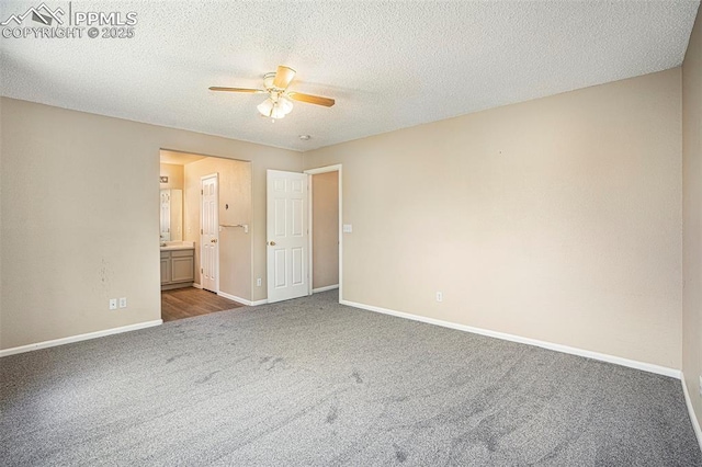 7120 Bonnie Brae Ln, Colorado Springs, CO 80922 - unfurnished bedroom with carpet flooring, baseboards, ensuite bathroom, a textured ceiling, and ceiling fan