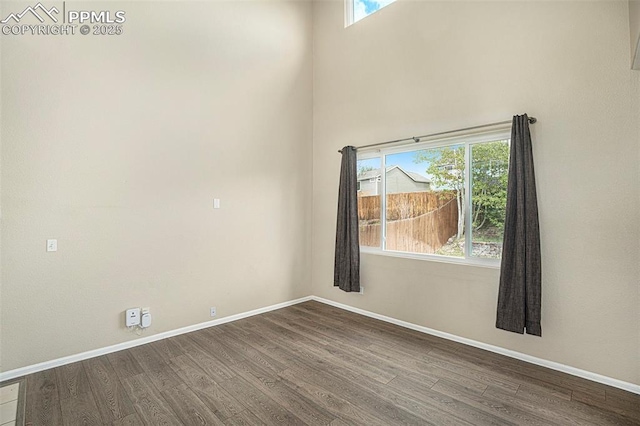 7120 Bonnie Brae Ln, Colorado Springs, CO 80922 - empty room with dark wood-style flooring and baseboards