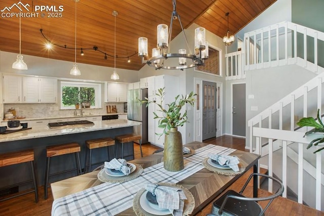 2530 White Rock Ln, Colorado Springs, CO 80904 - dining space with wood ceiling, a chandelier, stairs, lofted ceiling, and dark wood-style floors