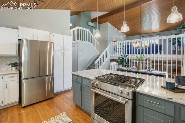 2530 White Rock Ln, Colorado Springs, CO 80904 - kitchen with appliances with stainless steel finishes, wooden ceiling, light wood-style flooring, white cabinets, and decorative light fixtures
