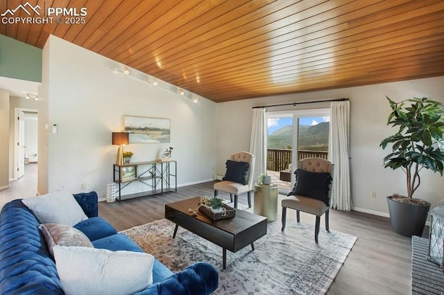 2530 White Rock Ln, Colorado Springs, CO 80904 - living area featuring wooden ceiling, wood finished floors, and baseboards