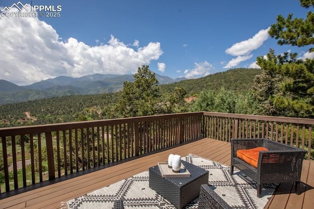 2530 White Rock Ln, Colorado Springs, CO 80904 - wooden terrace featuring a mountain view and a forest view
