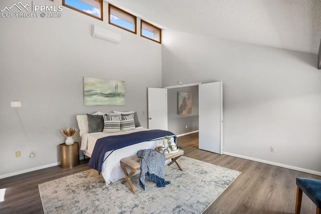 2530 White Rock Ln, Colorado Springs, CO 80904 - bedroom with wood finished floors, baseboards, and a towering ceiling