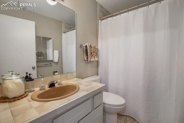 2530 White Rock Ln, Colorado Springs, CO 80904 - full bathroom featuring toilet and vanity