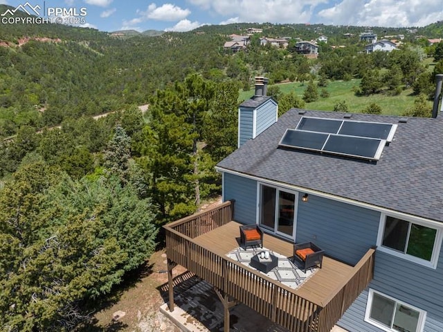 2530 White Rock Ln, Colorado Springs, CO 80904 - wooden terrace with a wooded view
