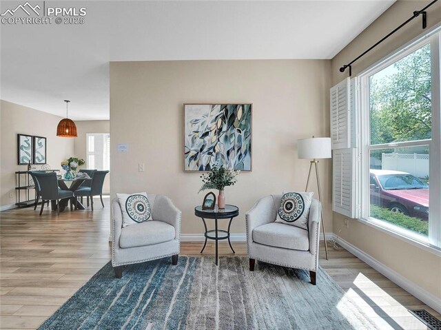 2209 Gilpin Ave, Colorado Springs, CO 80910 - living area featuring wood finished floors and baseboards