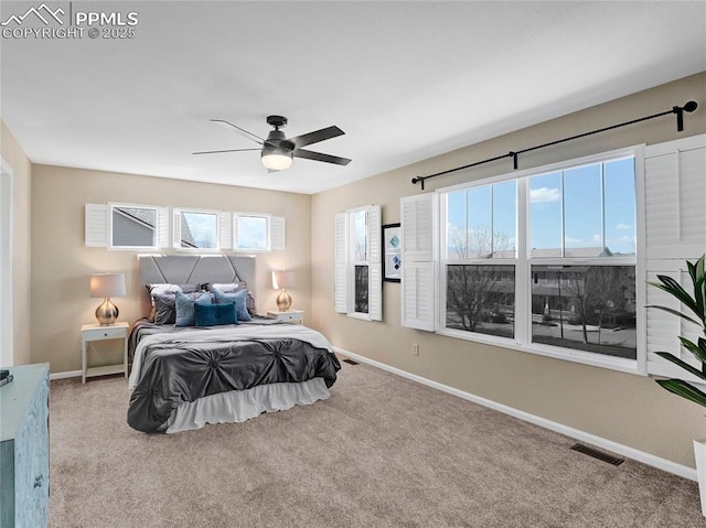 2209 Gilpin Ave, Colorado Springs, CO 80910 - carpeted bedroom with baseboards and a ceiling fan