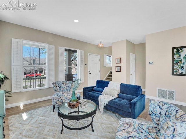 2209 Gilpin Ave, Colorado Springs, CO 80910 - living room featuring stairs, wood finished floors, baseboards, and recessed lighting