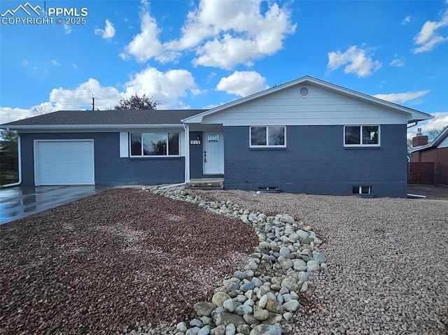 910 Dunston St, Colorado Springs, CO 80907 - single story home featuring brick siding, a garage, and concrete driveway