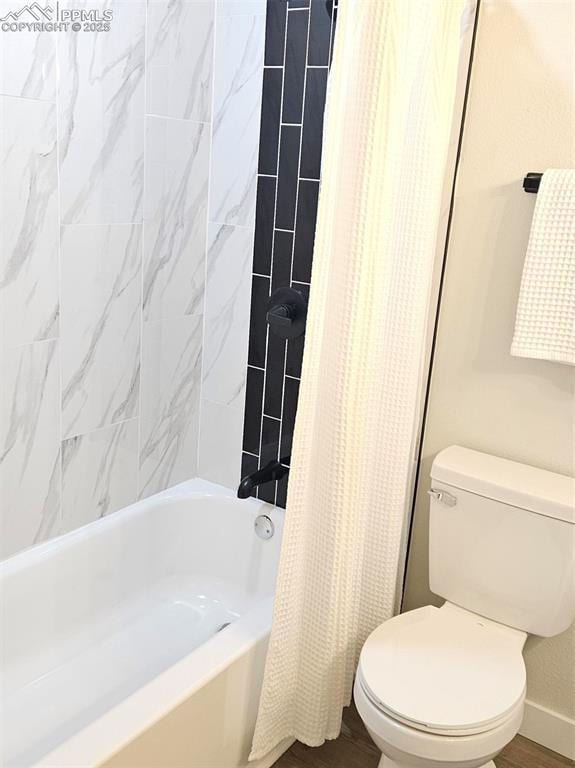 910 Dunston St, Colorado Springs, CO 80907 - full bath with toilet, wood finished floors, shower / bathtub combination with curtain, and baseboards