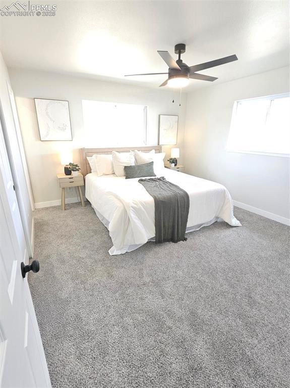 910 Dunston St, Colorado Springs, CO 80907 - bedroom with baseboards, carpet, and ceiling fan