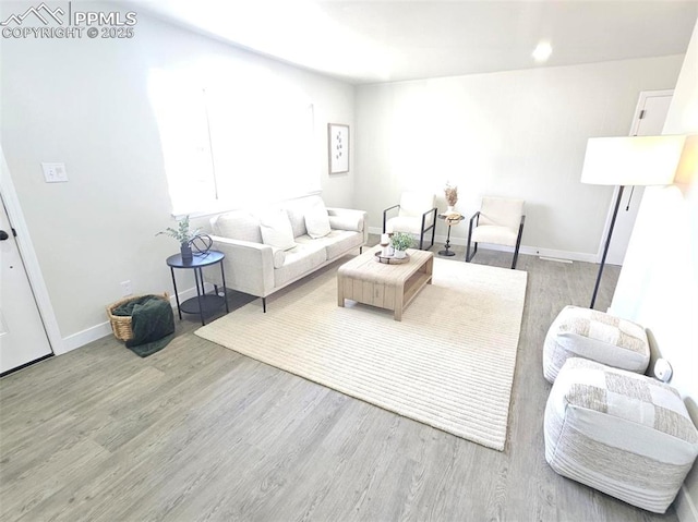 910 Dunston St, Colorado Springs, CO 80907 - living area featuring wood finished floors and baseboards