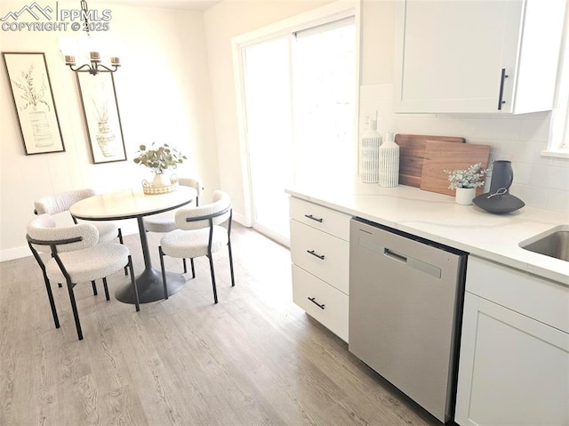 910 Dunston St, Colorado Springs, CO 80907 - dining room featuring light wood-type flooring, a chandelier, and baseboards