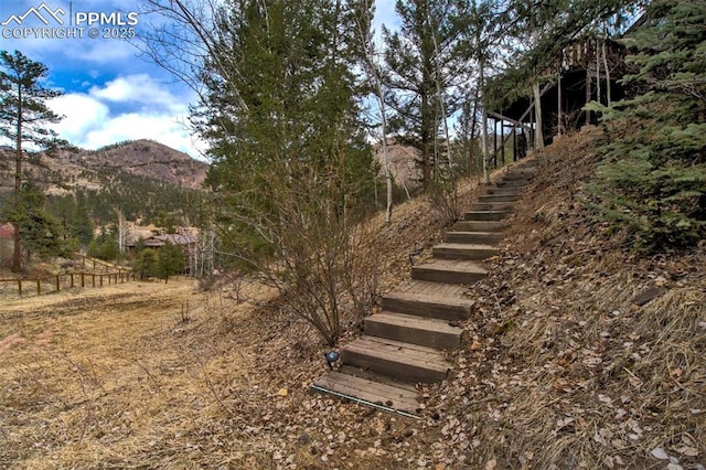 view of yard featuring stairway and a mountain view