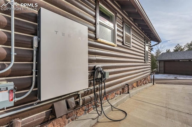 view of property exterior with an outbuilding
