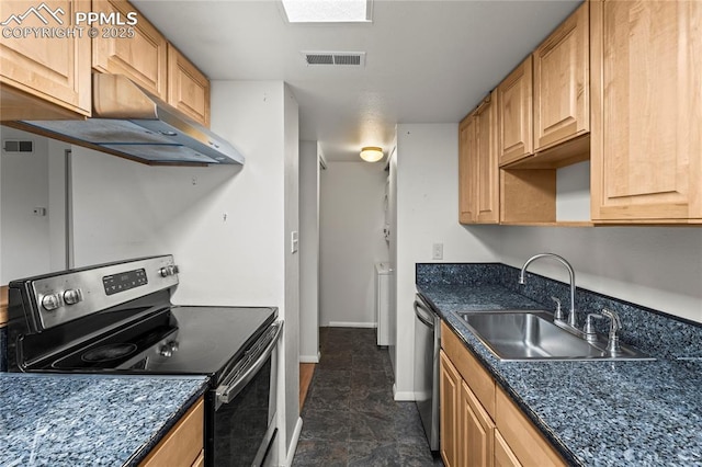 1002 Fontmore Rd Unit D, Colorado Springs, CO 80904 - kitchen featuring appliances with stainless steel finishes, under cabinet range hood, a sink, and baseboards