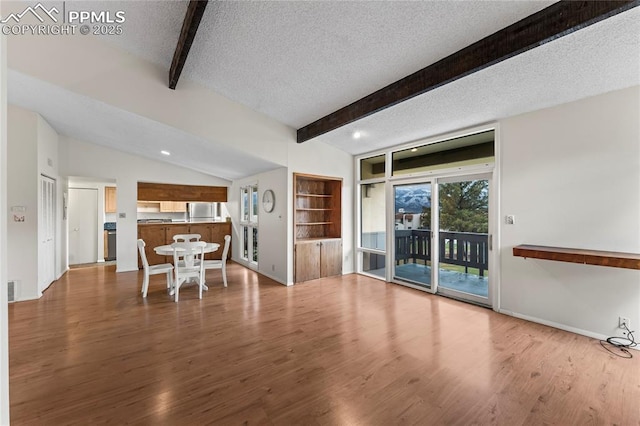 1002 Fontmore Rd Unit D, Colorado Springs, CO 80904 - living room with a textured ceiling, wood finished floors, baseboards, recessed lighting, and built in features