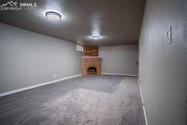 1701 Grant Ave, Colorado Springs, CO 80909 - below grade area featuring carpet floors, a fireplace, and baseboards