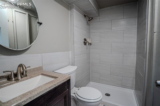 1701 Grant Ave, Colorado Springs, CO 80909 - bathroom featuring toilet, a shower stall, and vanity