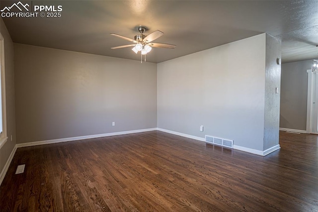 1701 Grant Ave, Colorado Springs, CO 80909 - spare room featuring a ceiling fan, dark wood-style floors, and baseboards
