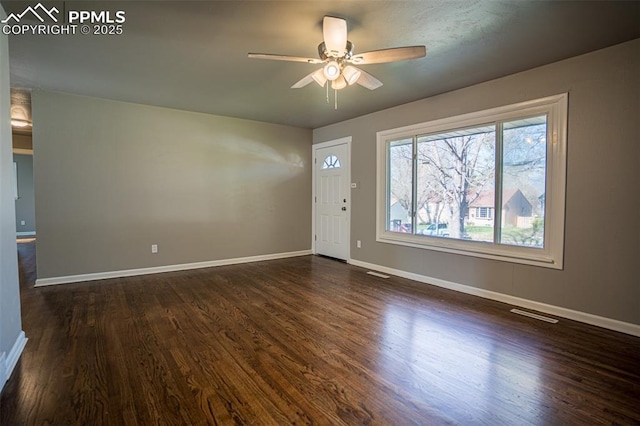 1701 Grant Ave, Colorado Springs, CO 80909 - spare room featuring a ceiling fan, baseboards, and dark wood-style floors