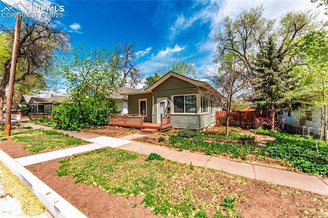 427 N Walnut St, Colorado Springs, CO 80907 - bungalow-style home with fence and a deck