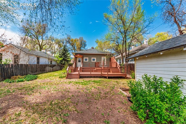 427 N Walnut St, Colorado Springs, CO 80907 - back of property featuring fence and a wooden deck