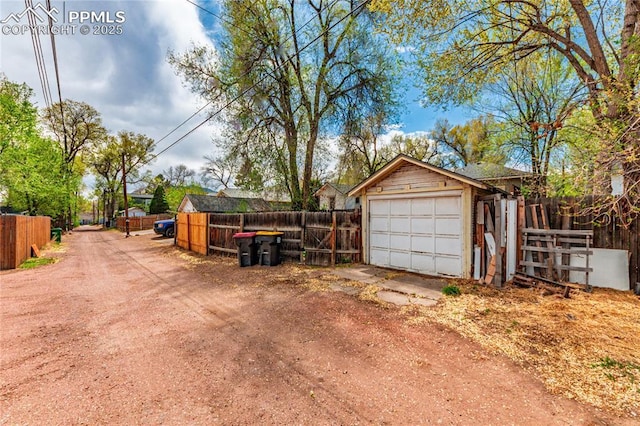 427 N Walnut St, Colorado Springs, CO 80907 - detached garage with fence and dirt driveway