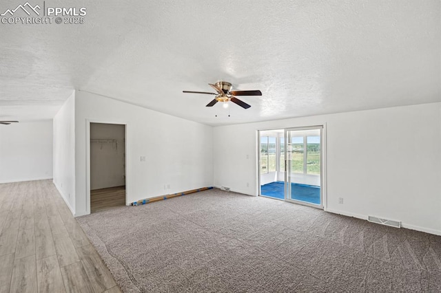 9775 Indian Village Hts, Fountain, CO 80817 - spare room with ceiling fan, a textured ceiling, baseboards, and carpet flooring