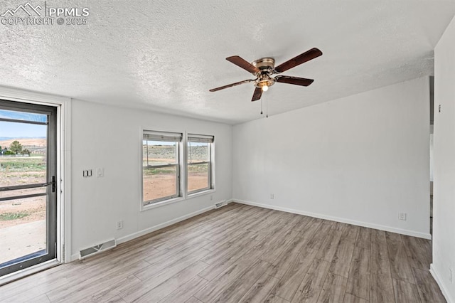 9775 Indian Village Hts, Fountain, CO 80817 - unfurnished room with wood finished floors, a ceiling fan, a textured ceiling, and baseboards