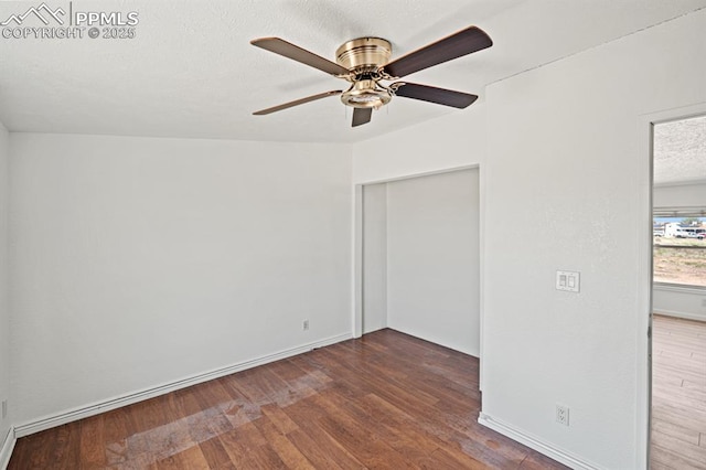 9775 Indian Village Hts, Fountain, CO 80817 - empty room featuring wood finished floors, a ceiling fan, baseboards, and a textured ceiling